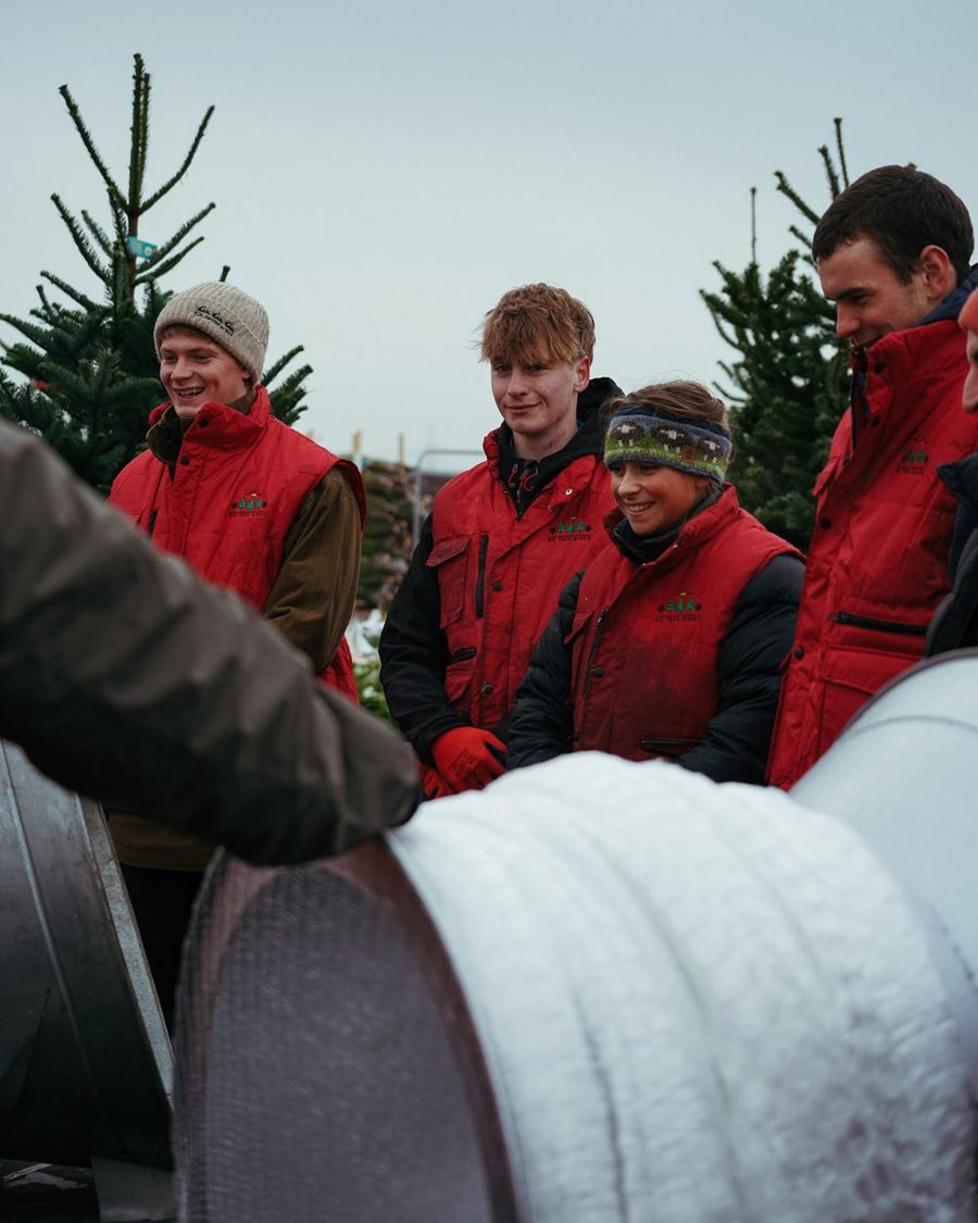 The We Tree Kings team in their red jackets in store